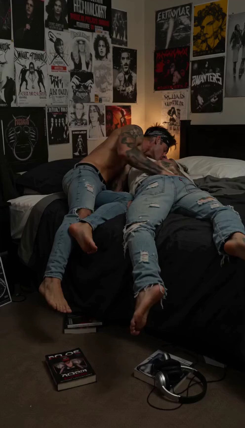 Camera starts at full body view and moves in on 2 grunge punk emo blonde men …